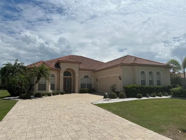 Exterior Front, Paved  Driveway, Side Facing Oversized Garage & Corner Lot