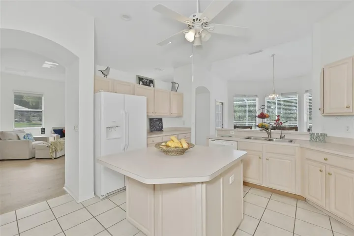 Refaced Cabinets, Tiled Floor, Large Center Island with Storage, Eat In Dinette With Great View of Pool & Rear Greenspace