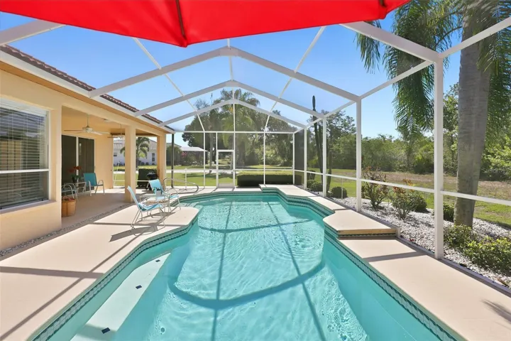 Inviting Resurfaced Pool w/Side Sitting Bench, Painted Coolcrete Pool Deck, Large Screened Lanai