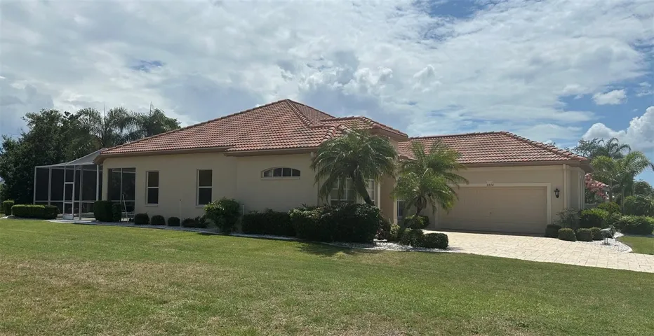 Beautiful Newer Tiled Roof, Exceptional Curb Appeal, Exterior Painted. Side Facing Garage & Pavered Driveway