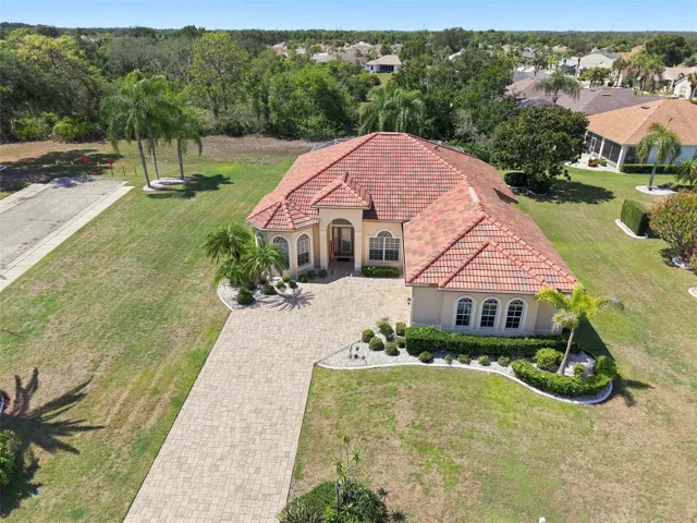 Aerial, Newer Tile Roof, Large Corner Lot, Paved Driveway, Oversized 2+ Car Garage