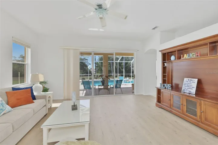 Living Room, Newer LVT Flooring, Sliders to Fabulous Pool & Outdoor Living Space