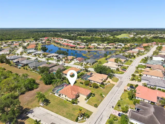 Aerial, Newer Tile Roof, Large Corner Lot, Paved Driveway, Oversized 2+ Car Garage