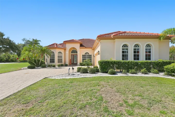 Exterior Front, Paved  Driveway, Side Facing Oversized Garage & Yard, Newer Tile Roof