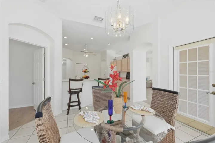 Dinette with Access to Rear Lanai & Large Bow Windows to View the Wonderful Outdoor Space