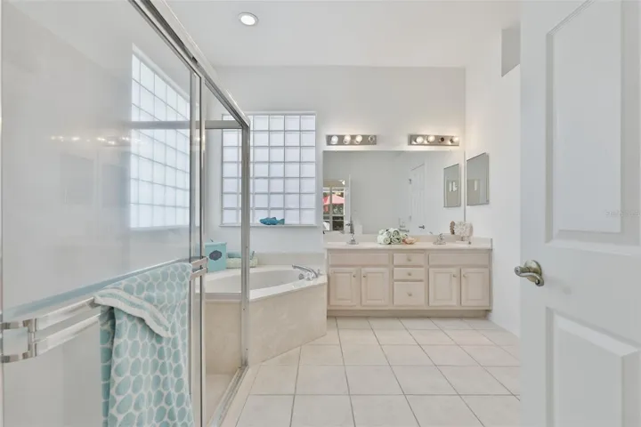 Primary Ensuite Bath, Walk-In Shower, Corner Spa Tub, Dual Vanities, Large Walk-In Closet