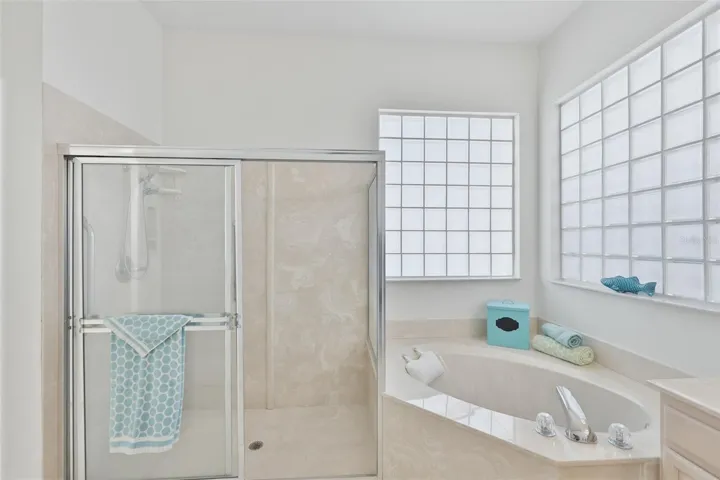 Primary Ensuite Bath, Walk-In Shower, Corner Spa Tub, Dual Vanities, Large Walk-In Closet