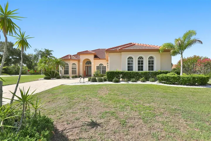 Exterior Front, Paved  Driveway, Side Facing Oversized Garage & Corner Lot