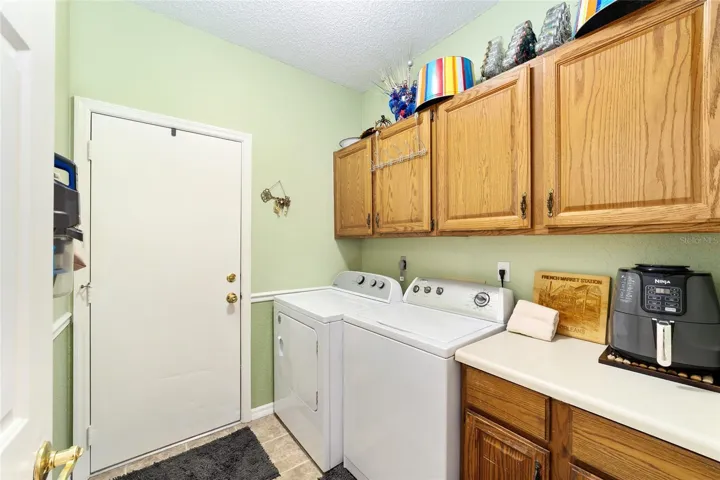 Laundry room with storage