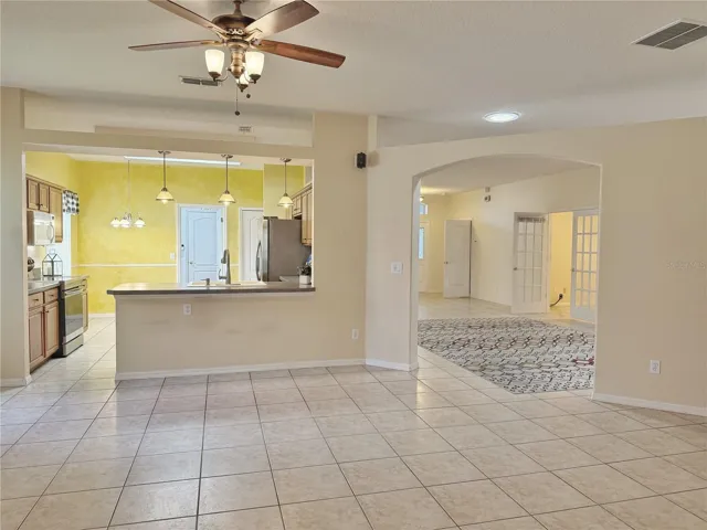 Closer view from Family room of Kitchen, dinette, living room and open floor plan, ceramic tile flooring, recessed lighting