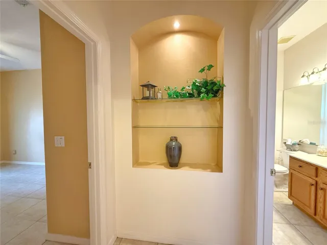 Niche between Bedroom 2 and Bathroom 2 with door to close it all off making it a owner suite