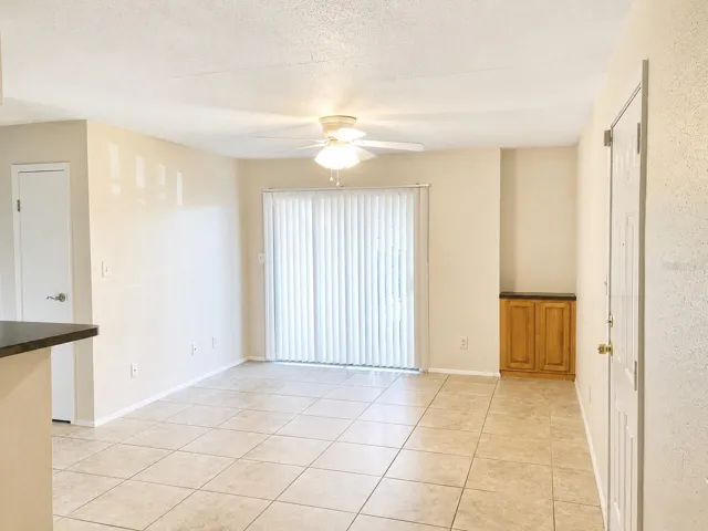 Living area with sliders to the screened patio.
