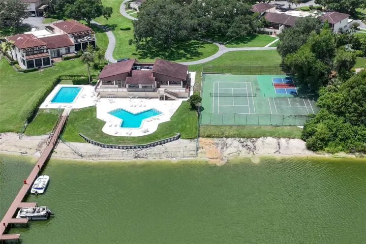 Aerial view of clubhouse, pools, tennis and pickelball courts