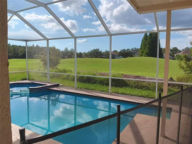 POOL WITH CHILD SAFTY FENCE FACING GOLF COURSE