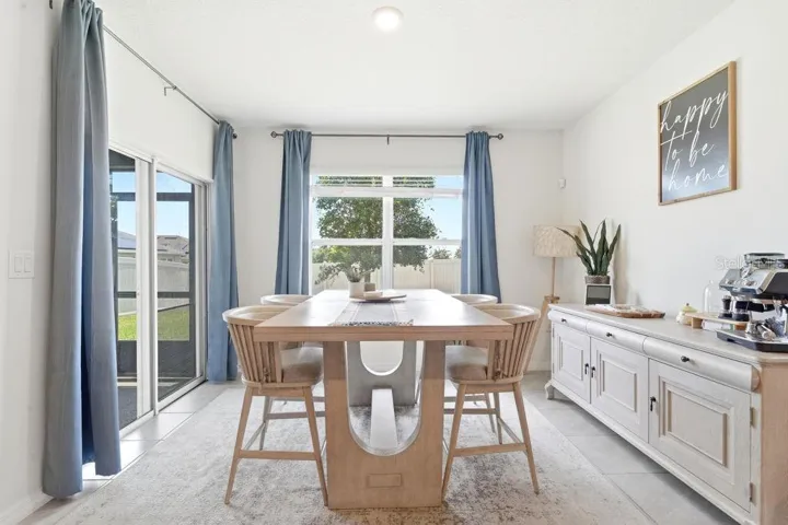 Dinging Room with Sliders to one side and large window on other