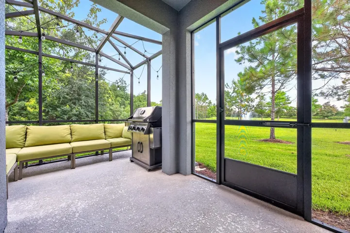 Extended screened lanai has pond views.