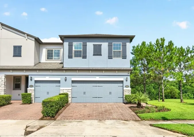 Welcome to Econ Landing, where this beautifully UPGRADED 3-bedroom, 2.5-bath END-UNIT townhome offers over 1,700 square feet of thoughtfully designed living space, designer finishes, and a premium homesite with peaceful CONSERVATION & POND VIEWS!