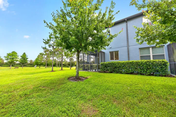 End unit townhome on a corner lot with wooded and water views!
