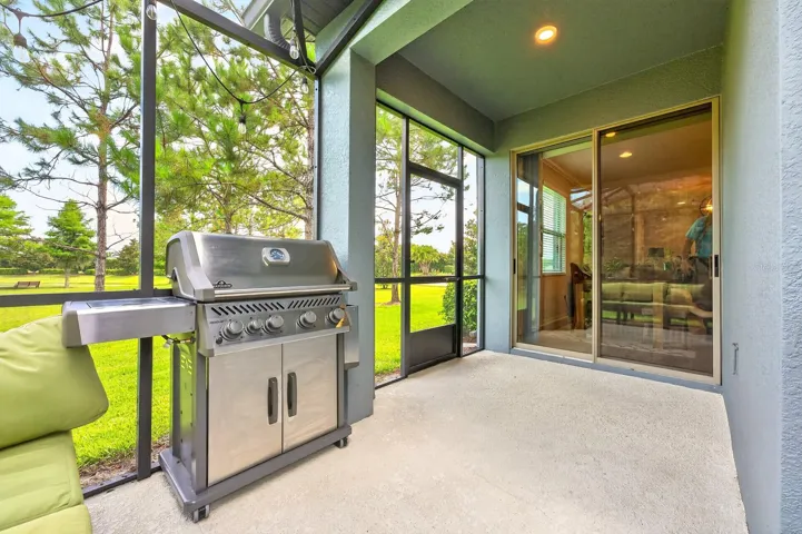 Extended screened lanai has pond views.