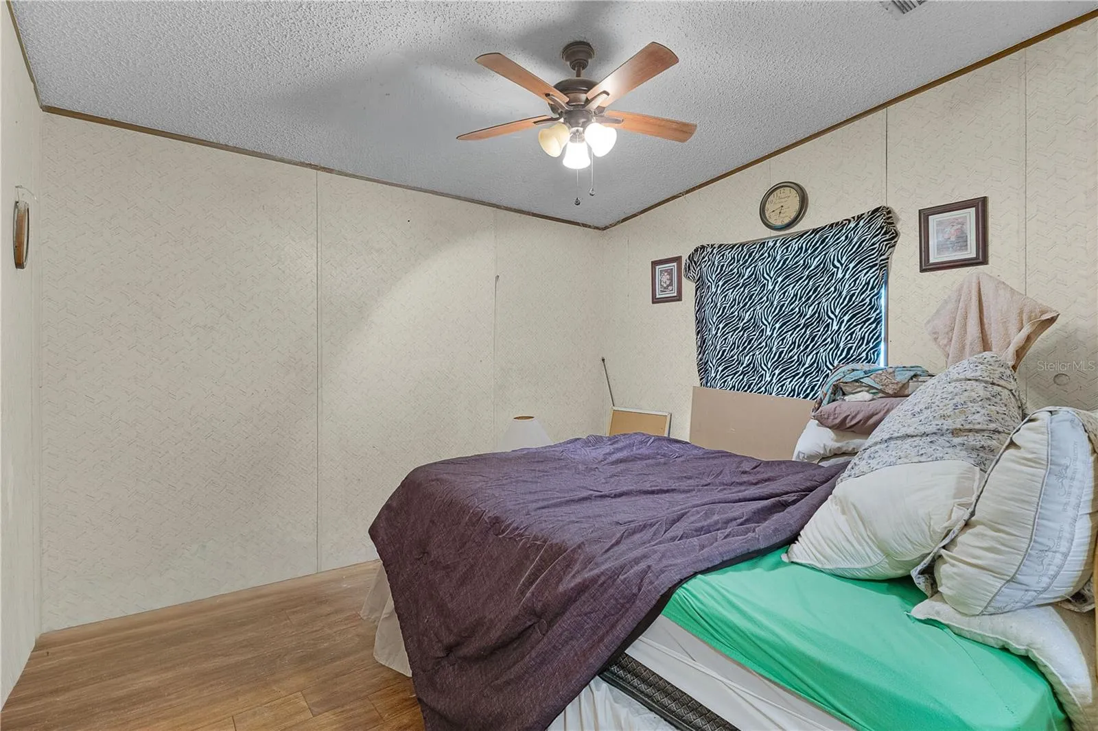 bedroom  two featuring a ceiling fan.