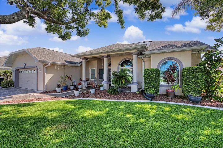 Enjoy the beautiful landscaping as you pull up.