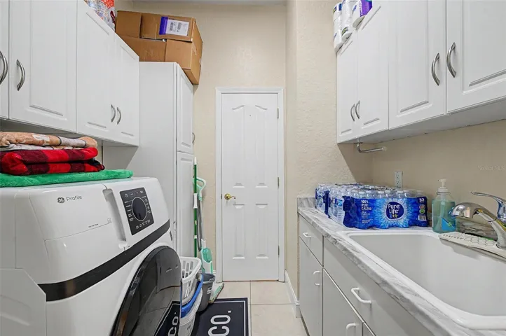 Laundry room near the two car garage.