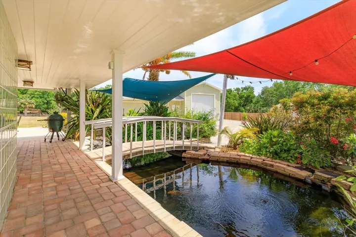 Covered paver patio and koi pond