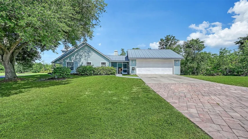 Exterior View with Attached Two Car Garage and Breezeway