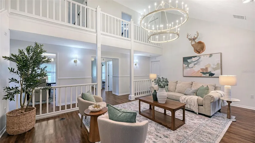 Living Room with Second Floor View of Balcony