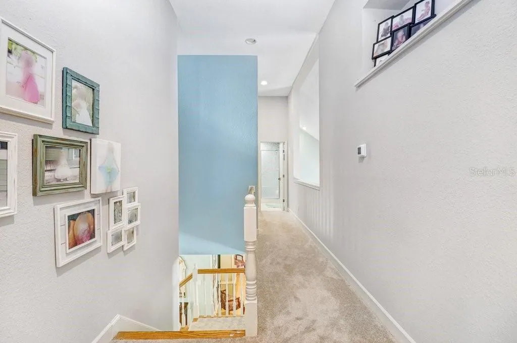 Hallway with pot shelves and open area to the Great Room