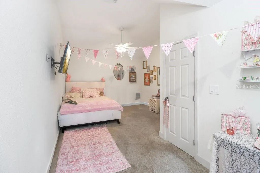 Spacious bedroom with plenty of space for queen sized bed and large walk in closet.