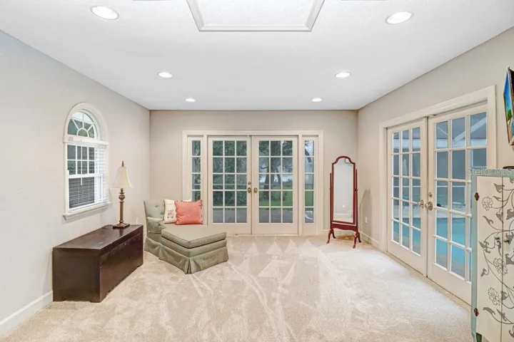Master bedroom has large sitting area with French doors to pool/patio area.  This area can also be used for yoga,or office space etc.
