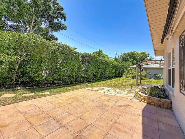 Patio overlooking Rear Green Space and Succulent Bed