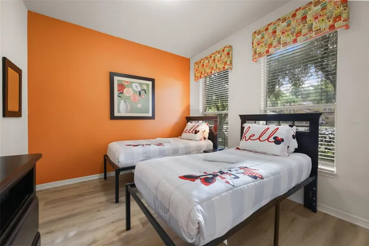 Disney-themed twin bedroom offering a fun and welcoming space for family and guests.