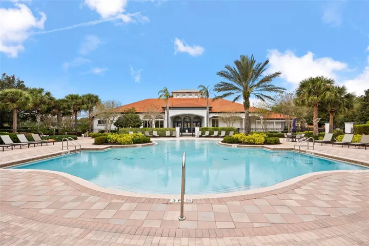 Another view of the impressive Watersong Resort community pool and elegant clubhouse.