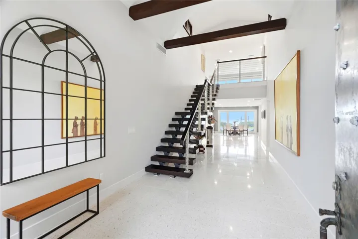 Foyer with floating staircase.