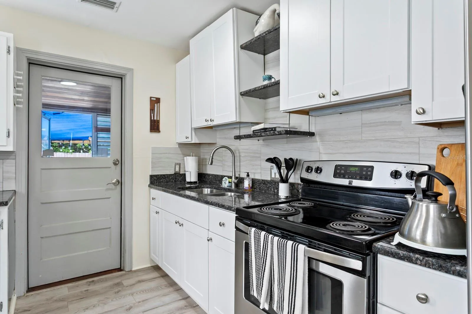 Kitchen has easy access to the laundry room,