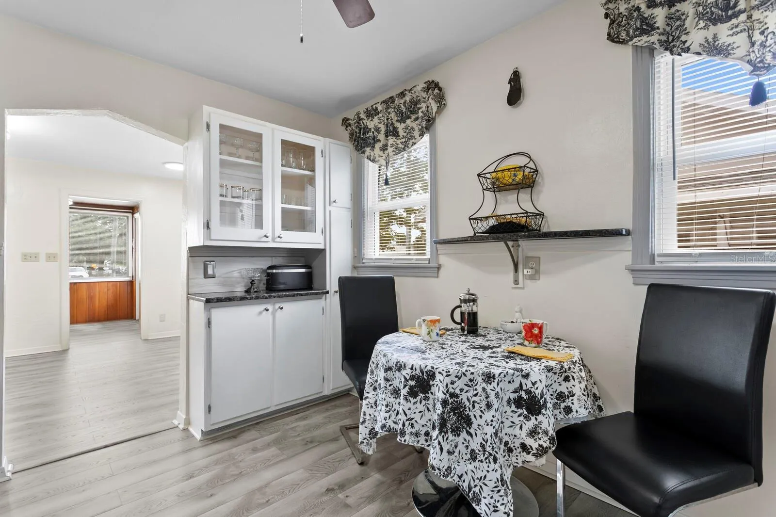 Eat-In area between two solid wood original cabinets with granite counters.