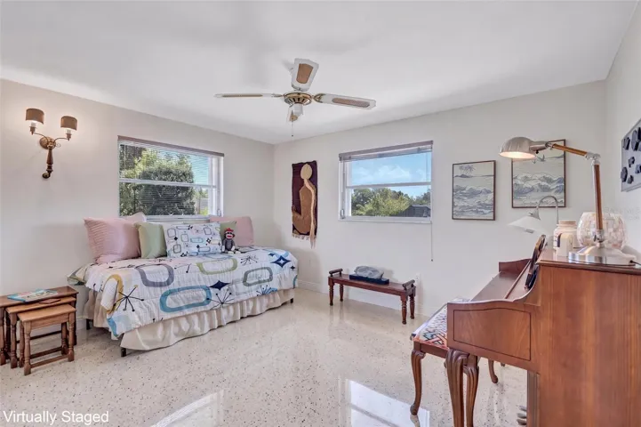 Virtually Staged 2nd Bedroom showing Terrazzo Flooring beneath the carpet.