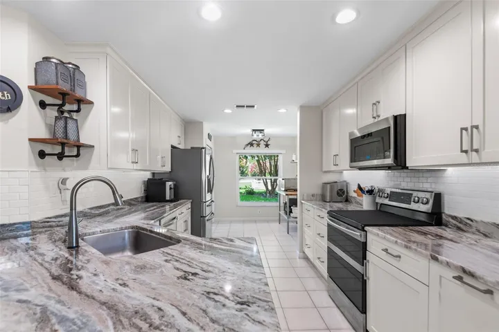Beautifully updated and thoughtfully designed, this inviting kitchen blends timeless finishes with modern functionality—creating the perfect space to cook, gather, and make lasting memories.