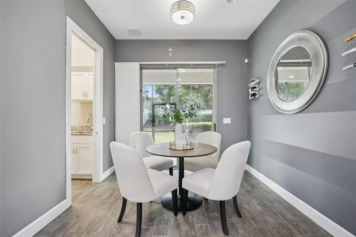 Dinette area w/ access to the rear screened porch & yard