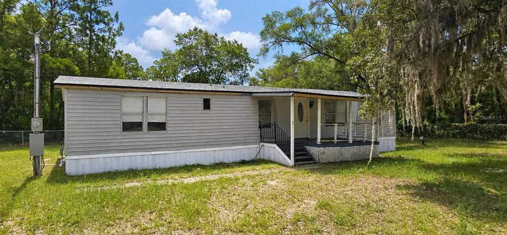 Front with covered porch newer roof