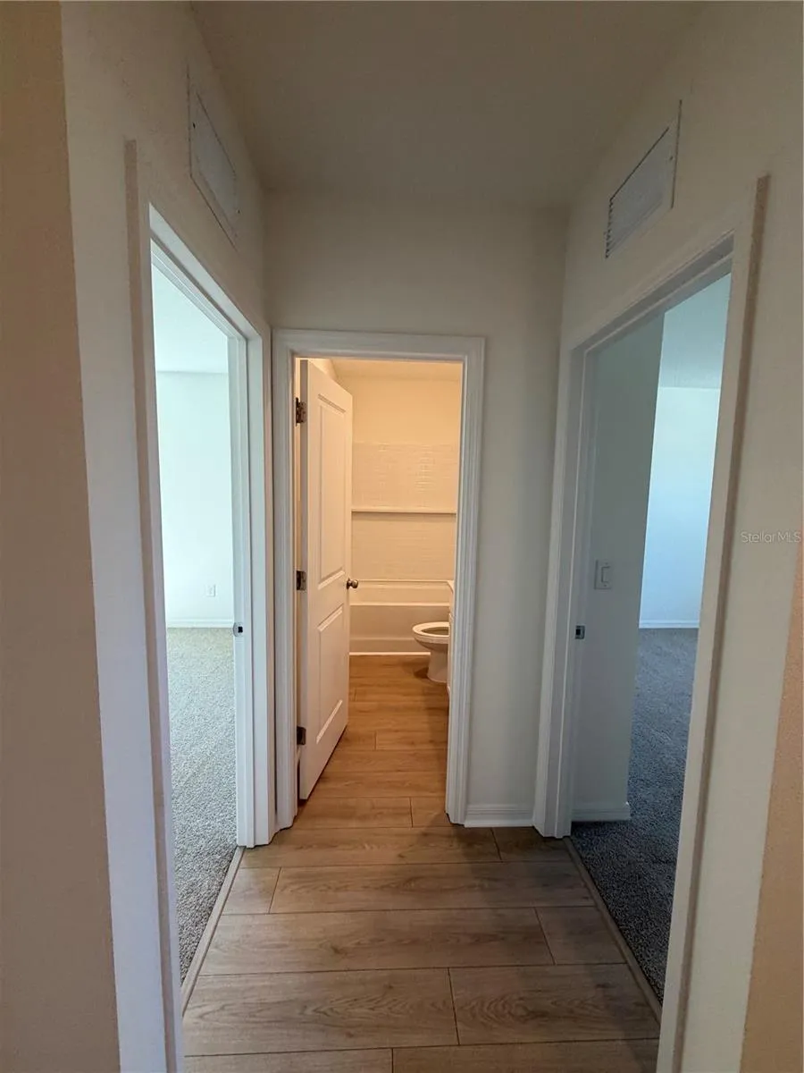 Hallway to guest bedrooms and bath