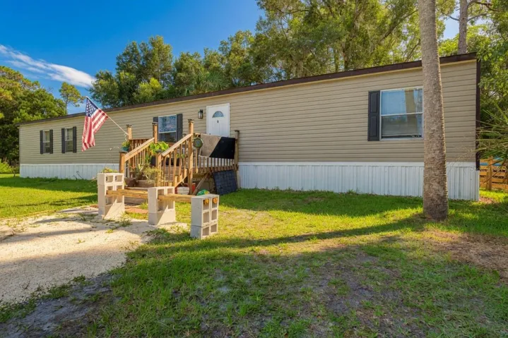 Front of the home with custom porch.