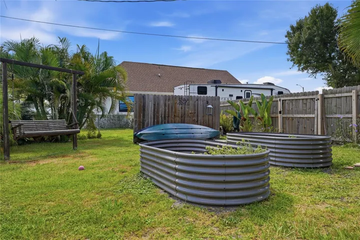 Fenced in yard with Swing