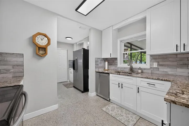 Kitchen window overlooking screened-in porch