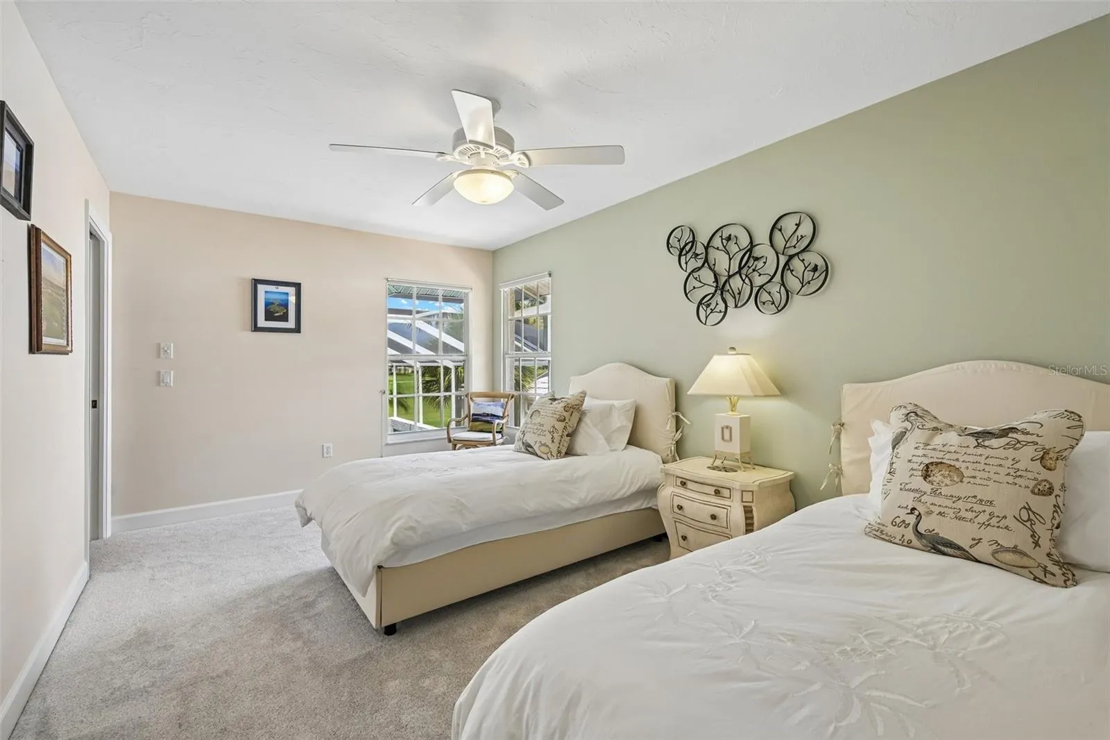 3rd bedroom (upstairs) with walk in closet, overlooking the pool and golf course.