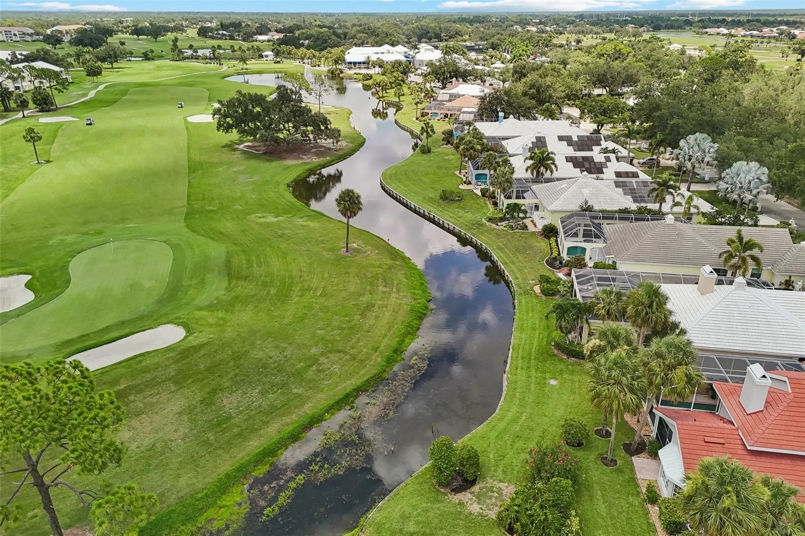 Intimate enclave of just 15 homes, situated along the 1st hole of the Bobcat Course. Easy stroll to the clubhouse (last white building in distance) - membership optional.