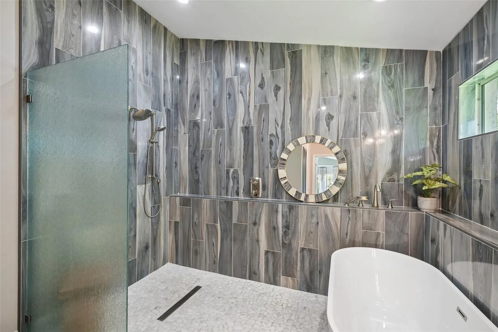 Oversized shower with dual shower heads.