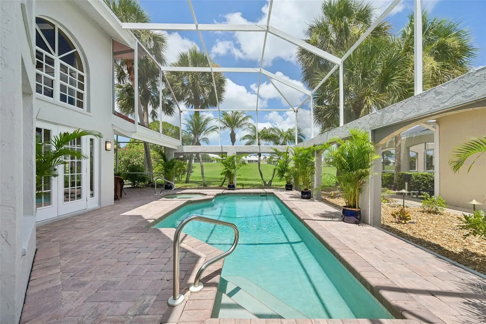 Relax in your heated pool and spa, overlooking the canal and 1st green of Plantation's Bobcat Course.